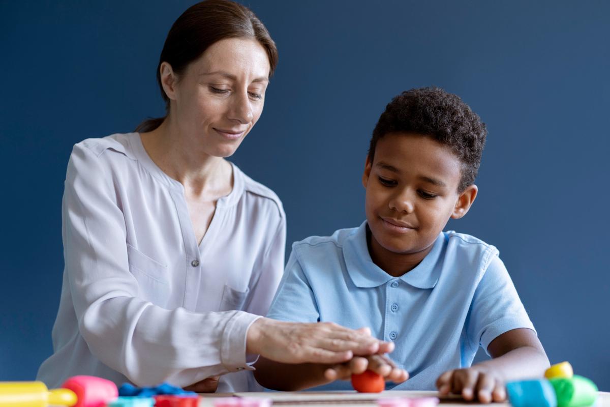 the picture displays the answer to the question "What Is an ADHD Assessment" as a women is assessing a young boy.